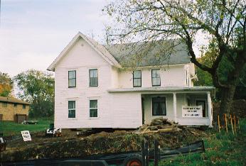 front view of house quite close to its final position, near the box elder tree